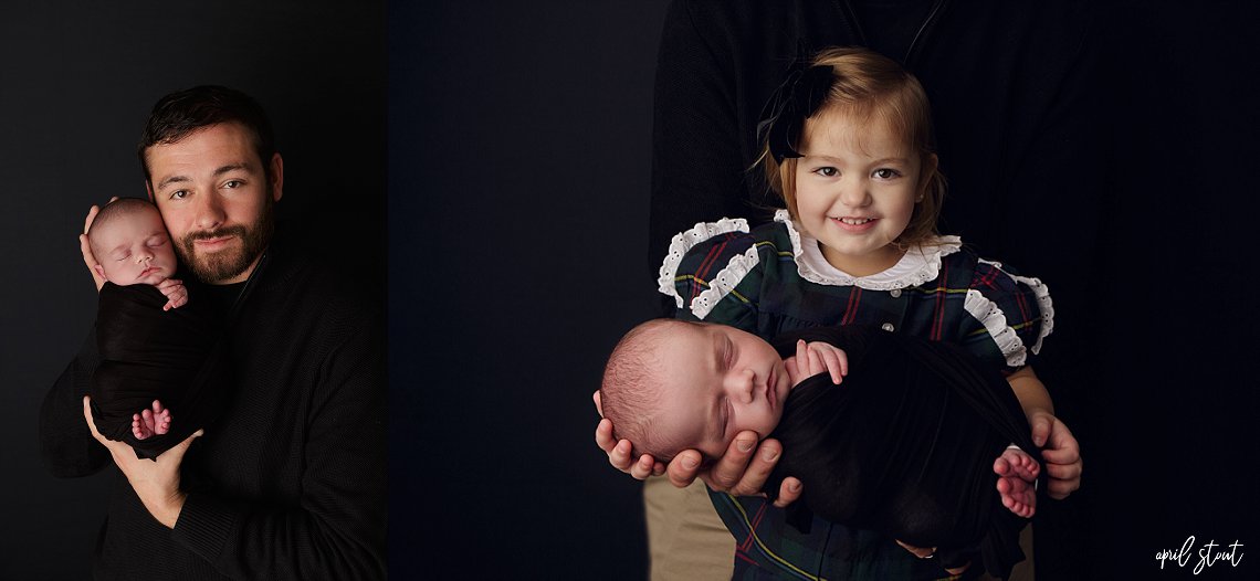 Jenks newborn photographer April Stout photographs baby boy with big sister on a classic black backdrop