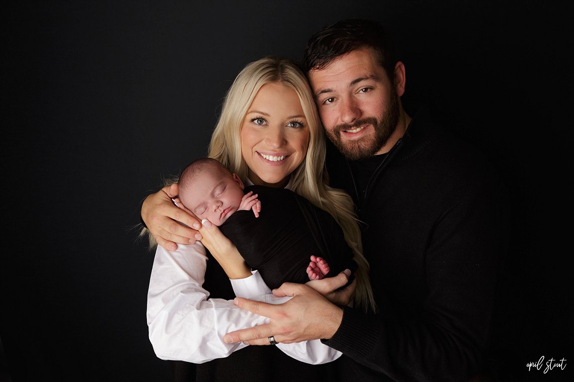 family photographer april stout near Jenks, oklahoma photographs newborn baby boy with parents