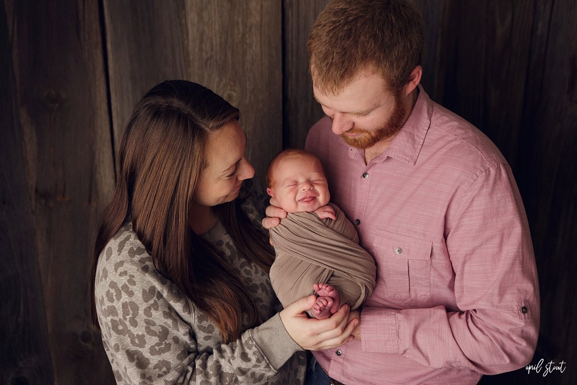 Tulsa family photographer April Stout captures new family with baby in studio