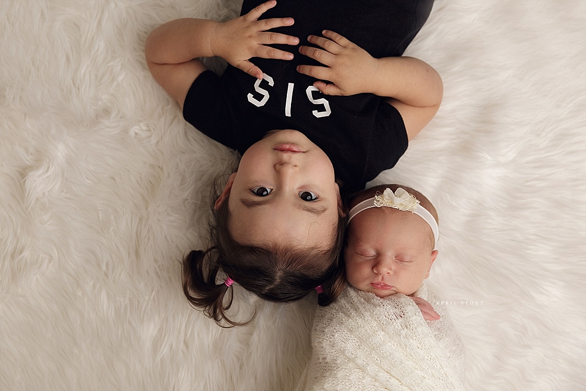new baby girl with big sister Tulsa Oklahoma newborn pictures with April Stout Photography